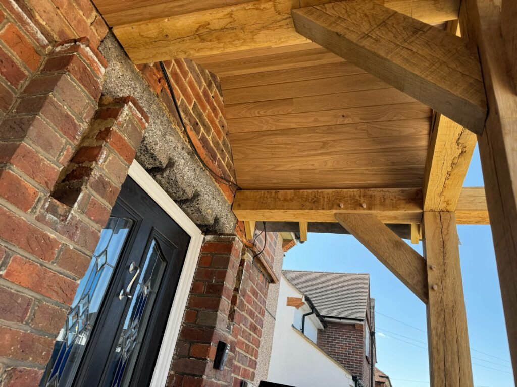 Side angle oak porch showing support beams and door